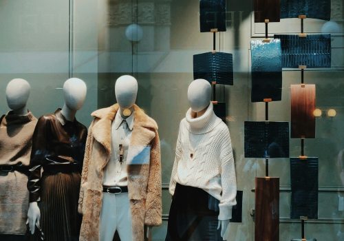 Stylish window display with modern fashion on mannequins. Perfect for showcasing boutique elegance.